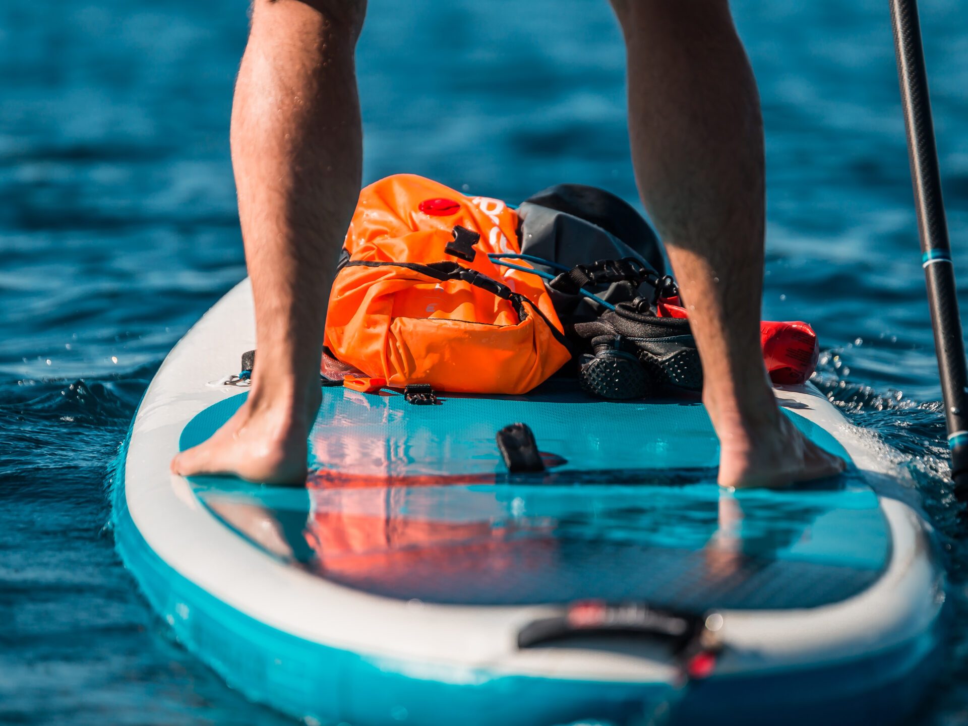 a person riding a surf board on a body of water