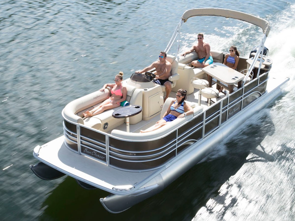 a group of people in a small boat in a body of water