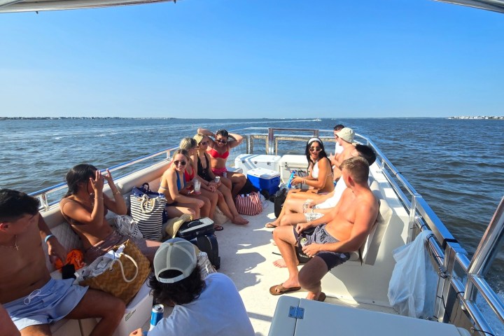 a group of people in a boat on a body of water