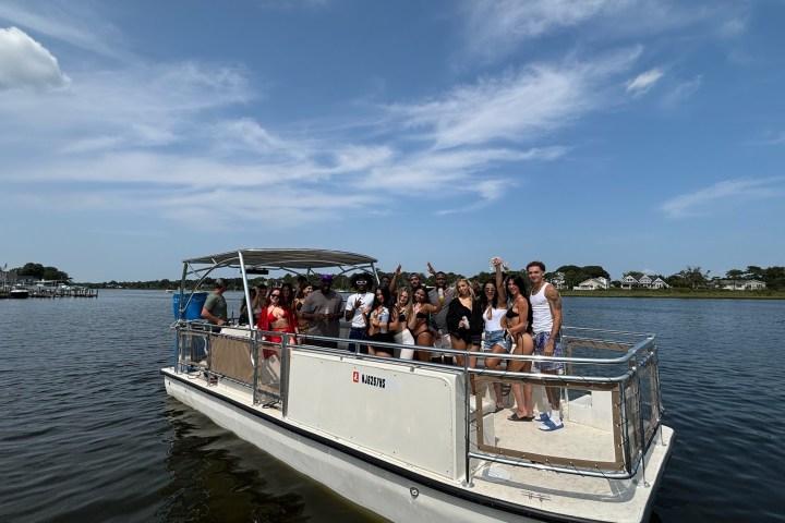 a group of people in a boat on a body of water